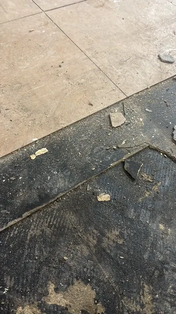 Black bitumen mastic floor removal in a NW3 flat